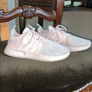 Kids light pink Adidas sneakers.